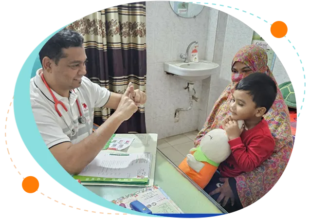 Child specialist examining a young boy during a pediatric checkup width=